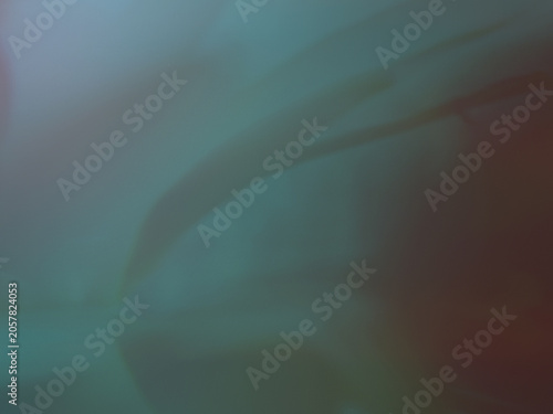 Dark moody abstract background with smooth sweeping shapes in deep teal and brown