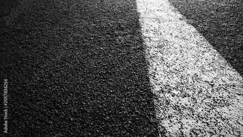 Asphalt Road Surface with White Lane Marking.