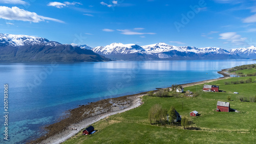 drone shot in the Lyngen Alps near the village Storsteinnes  in Norway