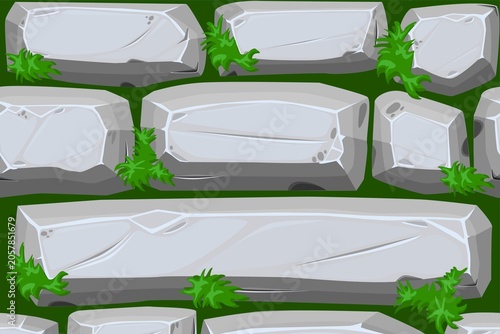 Gray stone blocks with green moss on grassy background