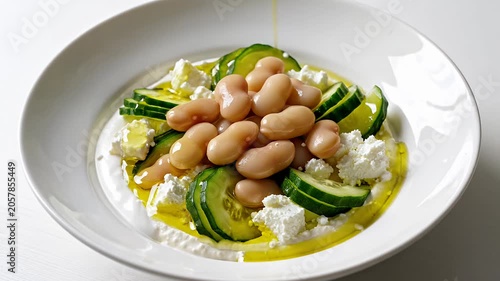White bean salad with cucumber and feta cheese.