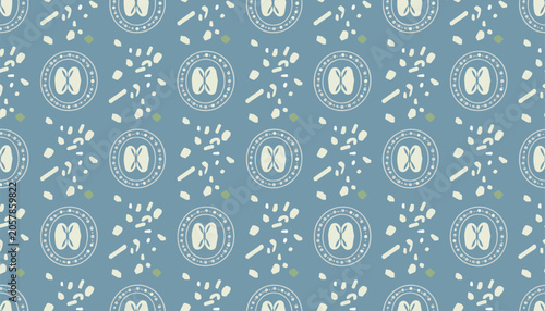 Bild auf Leinwand Seamless pattern of circular walnut halves, shell fragments, and small green dots on slate blue background