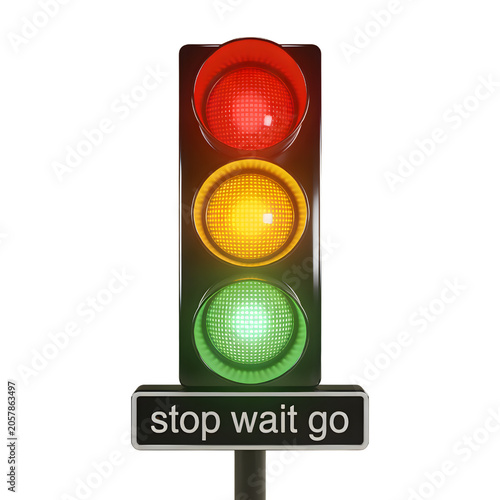Close-up of a modern vertical traffic light with red, yellow, and green signals illuminated.