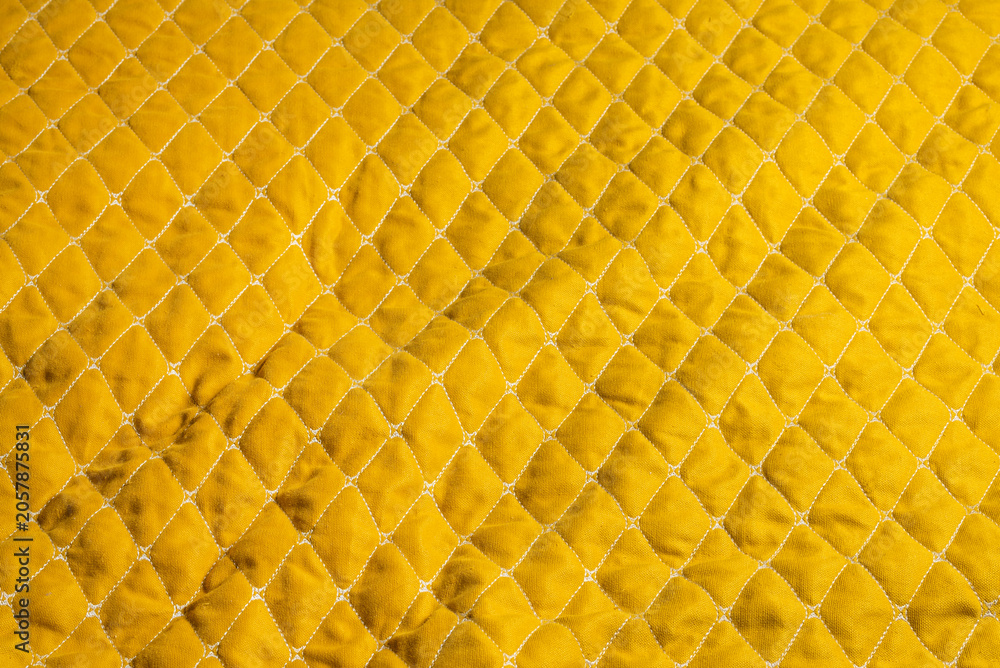Naklejka premium Yellow quilted fabric