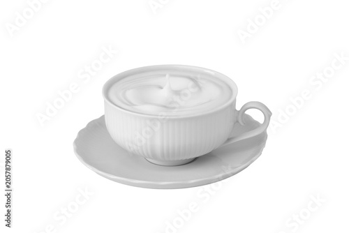 White ceramic cup and saucer filled with frothy milk, isolated element in PNG format.