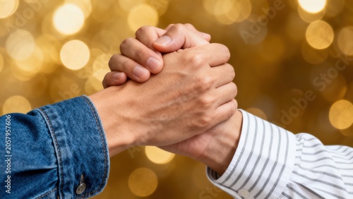 Two hands clasped together
