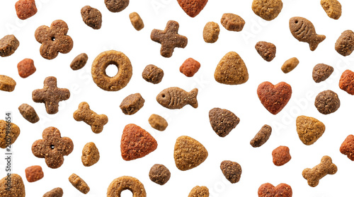 Floating dry cat food kibbles of various shapes