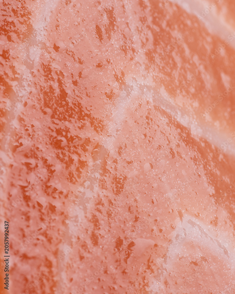 Fototapeta premium Raw salmon glossy texture vertical background fresh fish surface