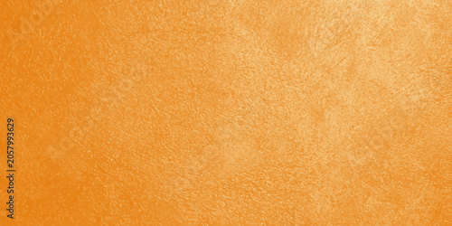 Valokuva Orange textured background with a grainy surface and subtle variations in tone t