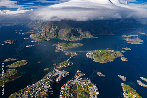 Принти на полотні Aerial scene of Lofoten Islands in Norway with fishing villages, bridges, fjords, and granite peaks under low cloud