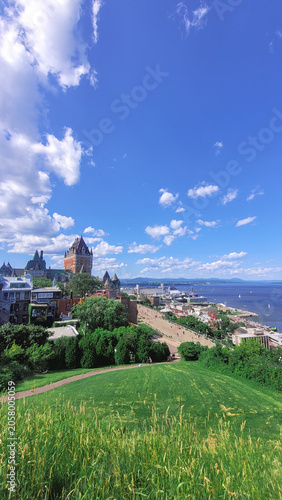 Famous Chateau Frontenac hotel and Dufferin Terrace in Quebec City on a sunny summer day