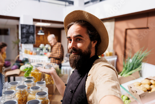 Tableau sur toile Zero waste shop owner does marketing inside a sustainable grocery store