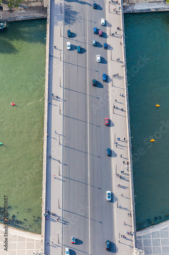 High angle view of vehicles crossing a bridge over the Seine River in Paris, France.