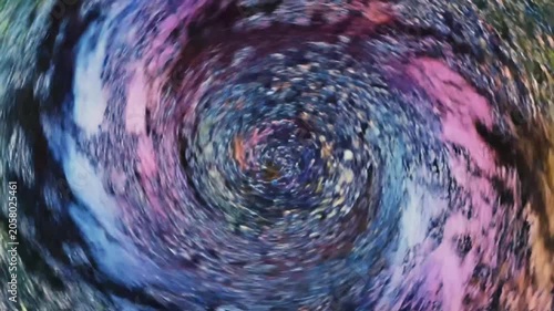 Abstract swirling cosmic texture with metallic center.