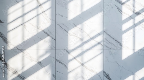 Sunlight patterns on white marble tiles