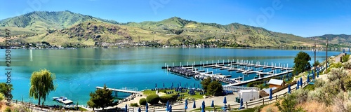 Lake Chelan and the marina at The Lookout in a panoramic view on a beautiful spring day showing the clear blue waters of the lake and Chelan Butte in the background_20260521_8750.