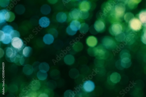 Cuadro en lienzo Abstract green bokeh lights creating a vibrant natural background with soft glow