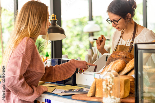 Quadro su tela Customer purchasing fresh bakery goods.