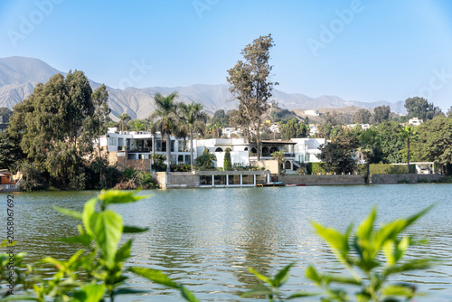 Photograph of a modern luxury mansion facade with premium architectural design in La Planicie, La Molina, Lima, Peru.