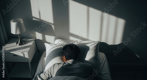Man Sleeping Peacefully In Bed With Morning Sunlight Streaming Through Window