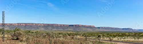 The sealed section at the start of the Gibb River Road with the spectacular Cockburn Ranges in the background in the East Kimberley region of Western Australia.
