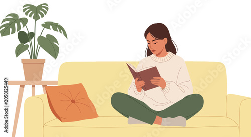 Young woman reading a book on a sofa, cozy home interior, relaxed lifestyle