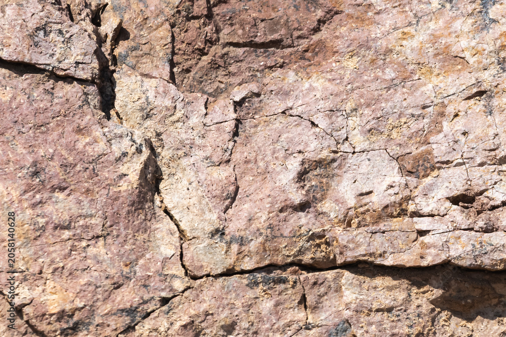Fototapeta premium Natural Cracked Rock Texture Background with Earth Tones