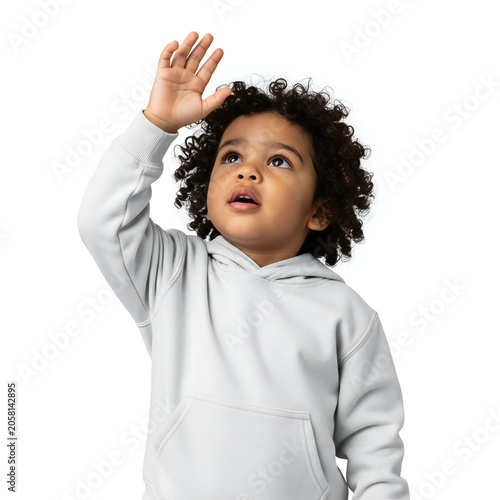 Young child looking up with hand raised in curiosity isolated on white background