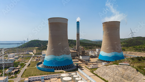 Coastal Power Plant With Cooling Towers And Wind Turbines