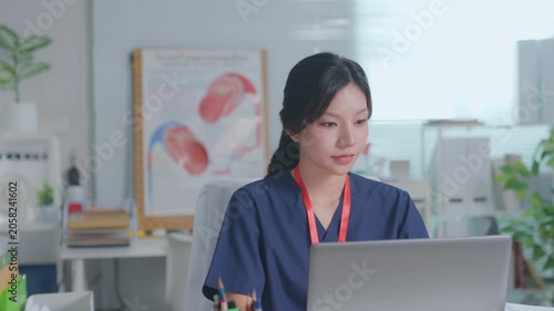 Doctor entering electronic medical records. Medical, asian woman working with computer in medical consultation at hospital. which are recording diagnoses and patient symptoms. Healthcare and medicine
