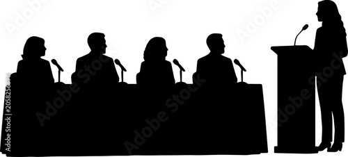 Silhouette of a woman speaking at a podium to a seated panel of four people at a conference or public hearing