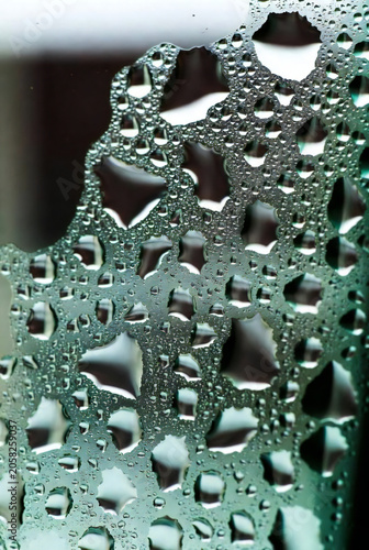 Extreme close-up of water droplets on glass, hyper-real texture, macro photography 