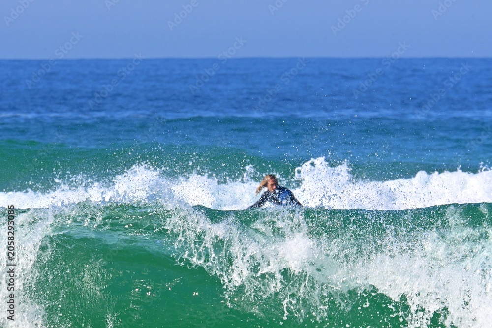 Obraz premium Surfing in the mighty ocean waves off the Atlantic coast of Ferrol, Spain May 12, 2026