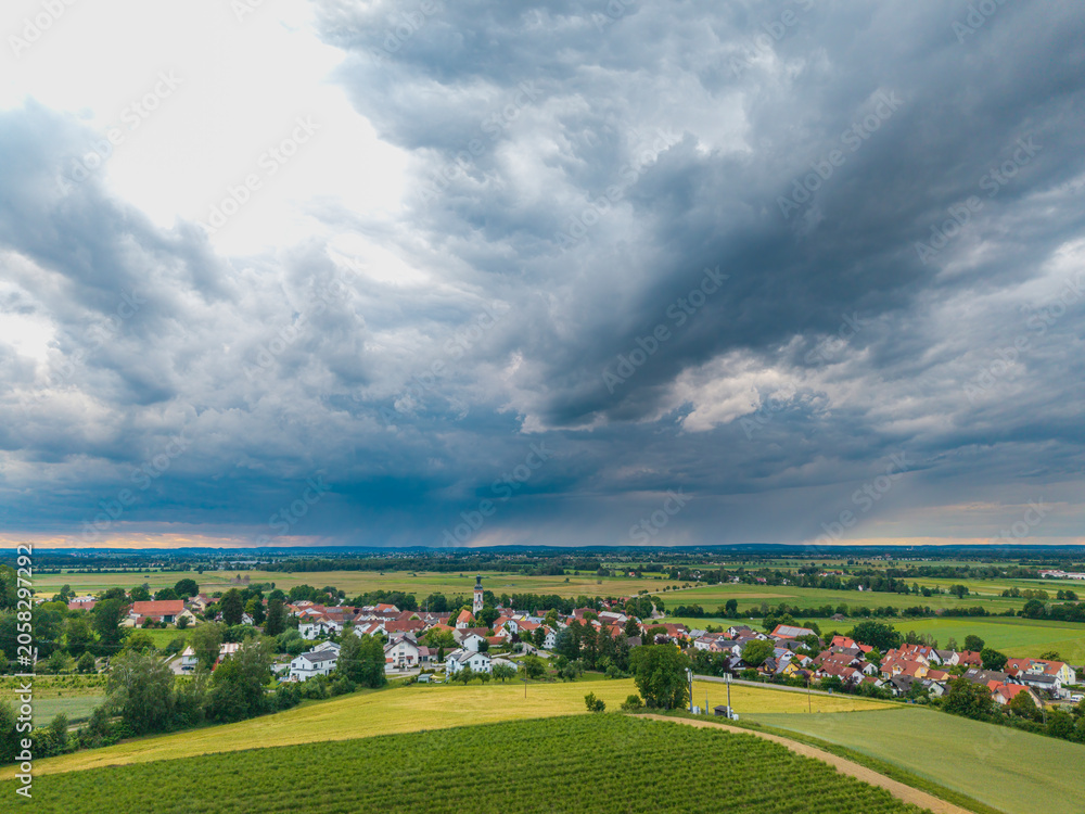 Fototapeta premium Bad weather conditions coming with rain and thunder due to global warming it change very fast from sun to rain and hail which damage our house and land