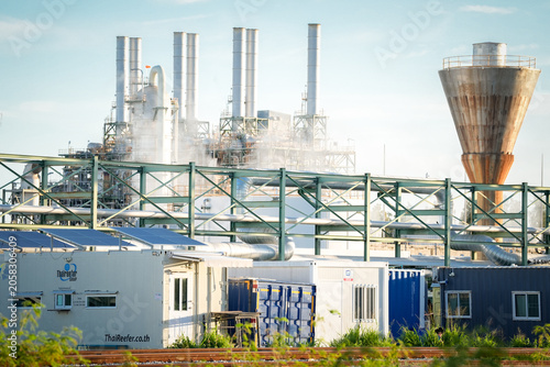 Фотография Industrial plant factory smokestack pipeline steel structure storage tank steam