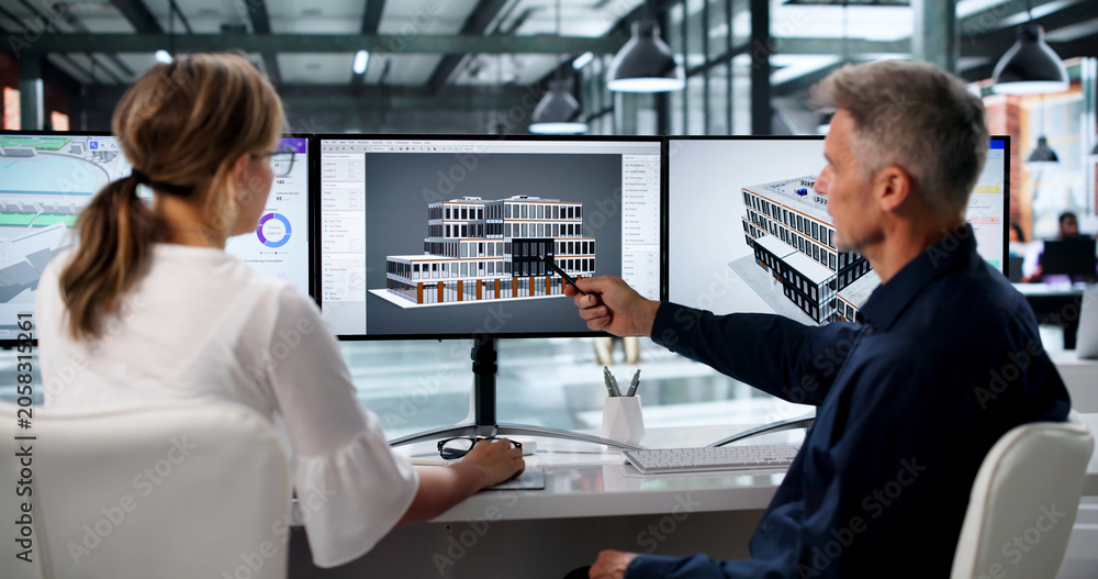Fototapeta premium Two Engineers Discuss 3D Building Plans Using BIM Software