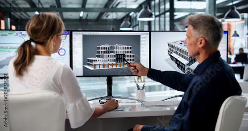 Cuadro en lienzo Two Engineers Discuss 3D Building Plans Using BIM Software