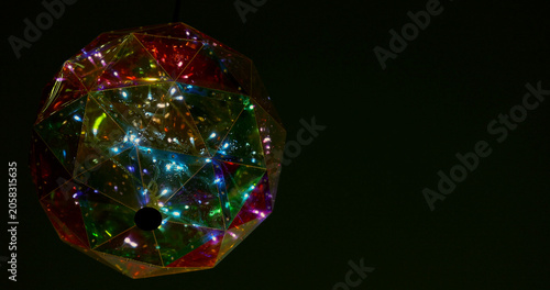 Bild auf Leinwand Colorful geometric light fixture glows brightly in dark space