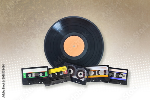 vynil disc and audio cassettes on grunge background