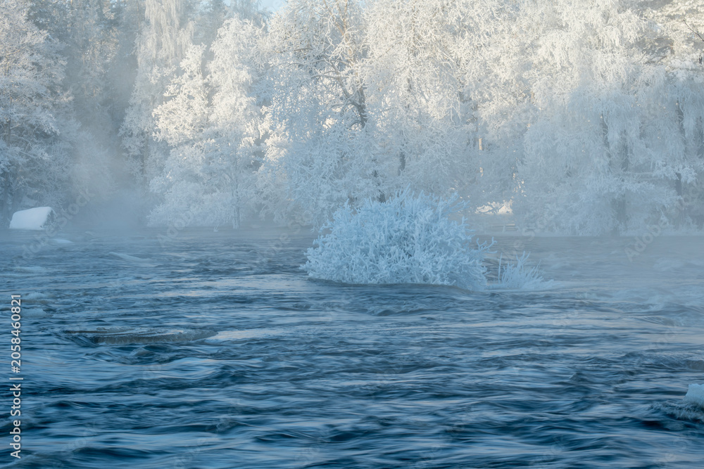 Naklejka premium River landscape with snow and frost. Farnebofjarden national park in winter.