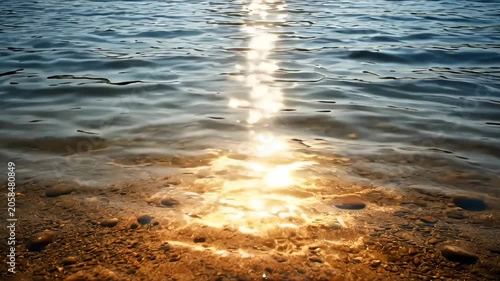 Calm Water Shoreline Sunset Reflection Pebble Beach With Golden Light, Sunlight On Water, Rippled Lake Shore, Rocky Beach