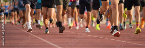 Athletics people running on the track field, large group of runners