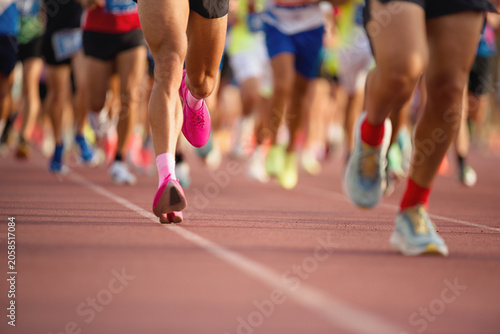 Athletics people running on the track field, large group of runners