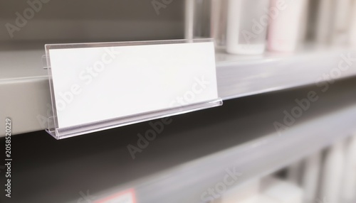 Blank retail shelf talker sign mockup in store