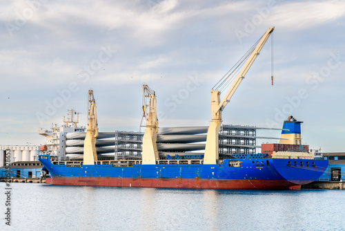 Chinese heavy lift cargo vessel unloading wind turbine blades while docked at Port Adelaide, South Australia. 