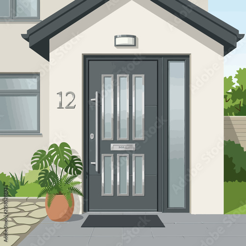 Modern house entrance with a gray door and potted plant