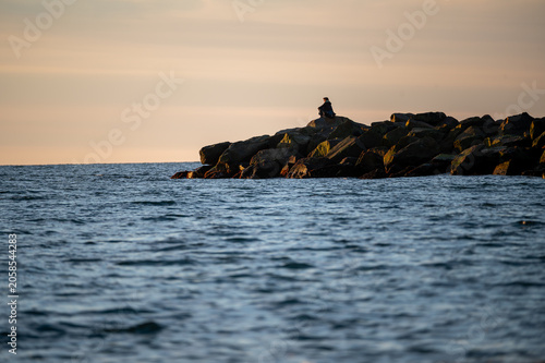 A figure in solitude at Sunset