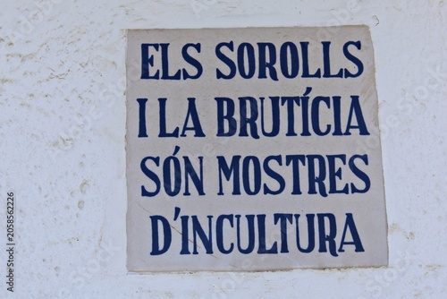Tableau sur toile Traditional ceramic plaque embedded in a whitewashed wall featuring the Catalan