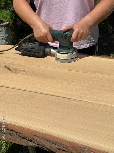 Handcrafted Oak Wood Sanding in Home Workshop
