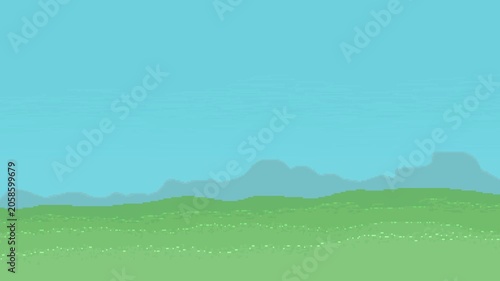 A beautiful day mountain in the distance, glistening grass, and a clear blue sky (can loop)